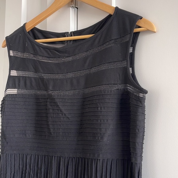 Long, chic black Tadashi Shoji gown with mesh-like panels and ribbed midsection - Picture 6 of 12